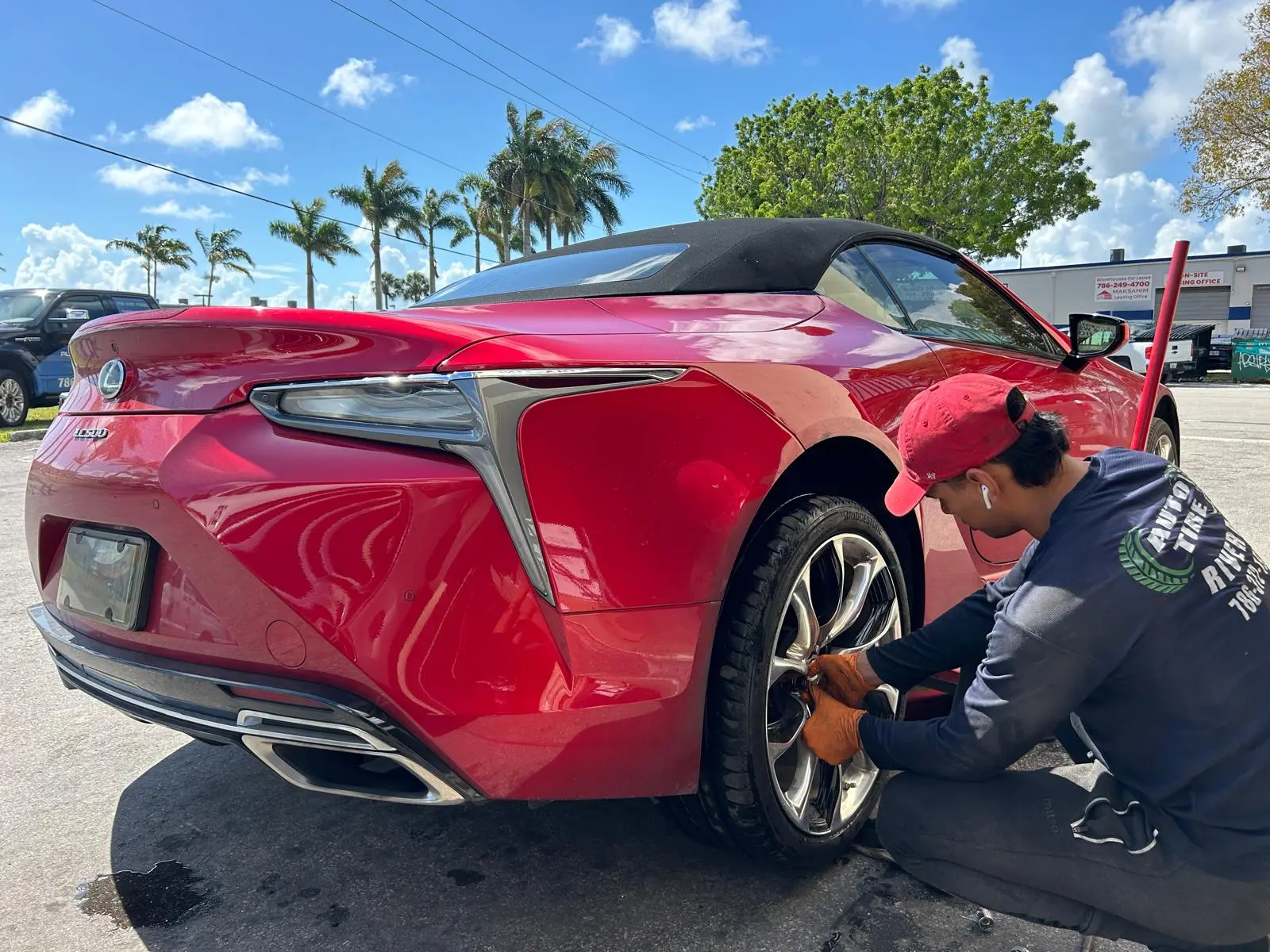 Tech working on a Lexus LC500's rear wheel