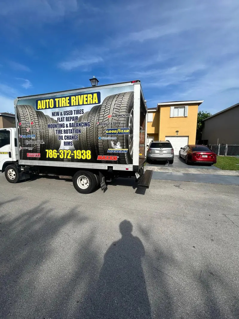 The Auto Tire Rivera mobile van, wrapped and parked at a customer's home